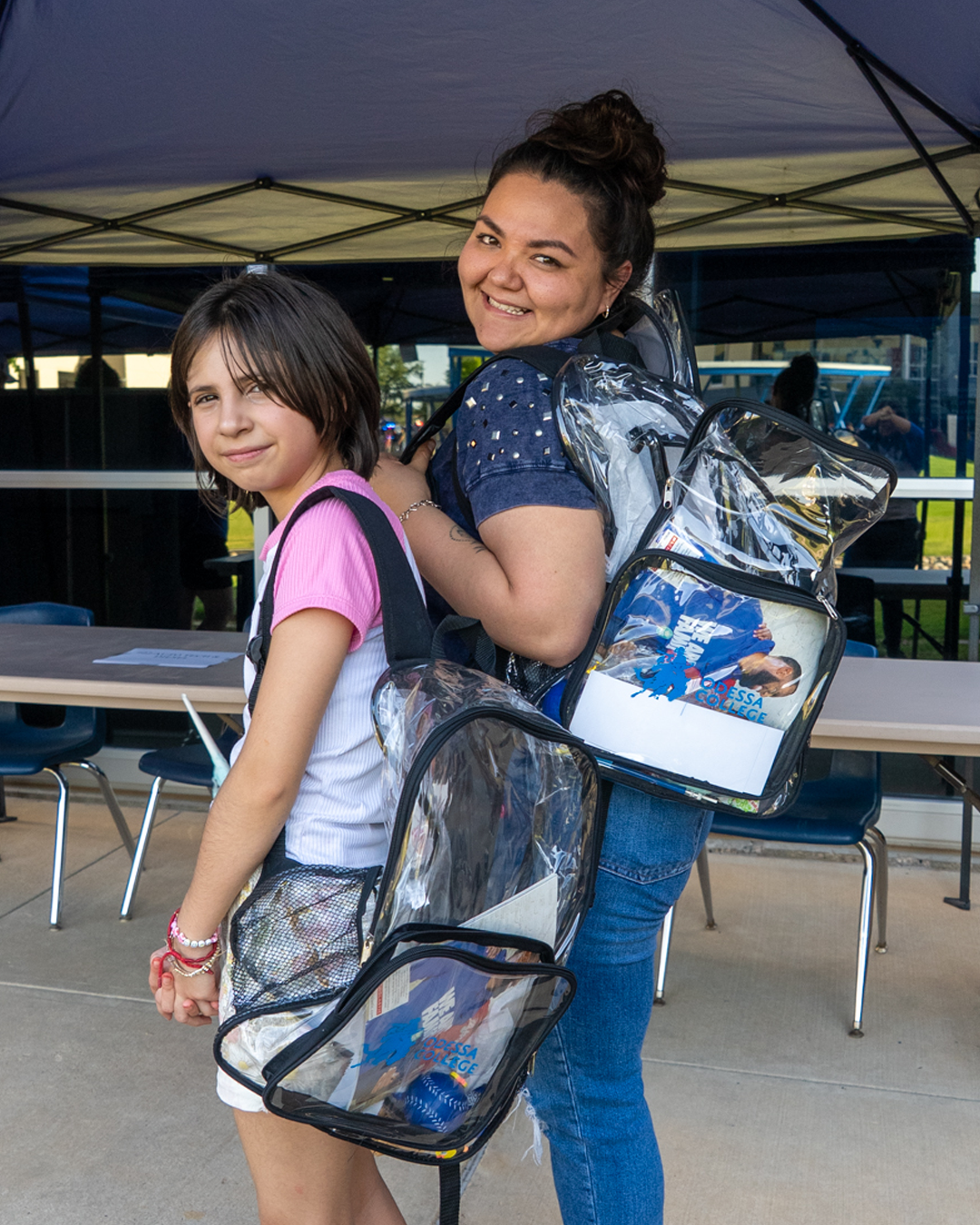 Two students with clear plastic bags
