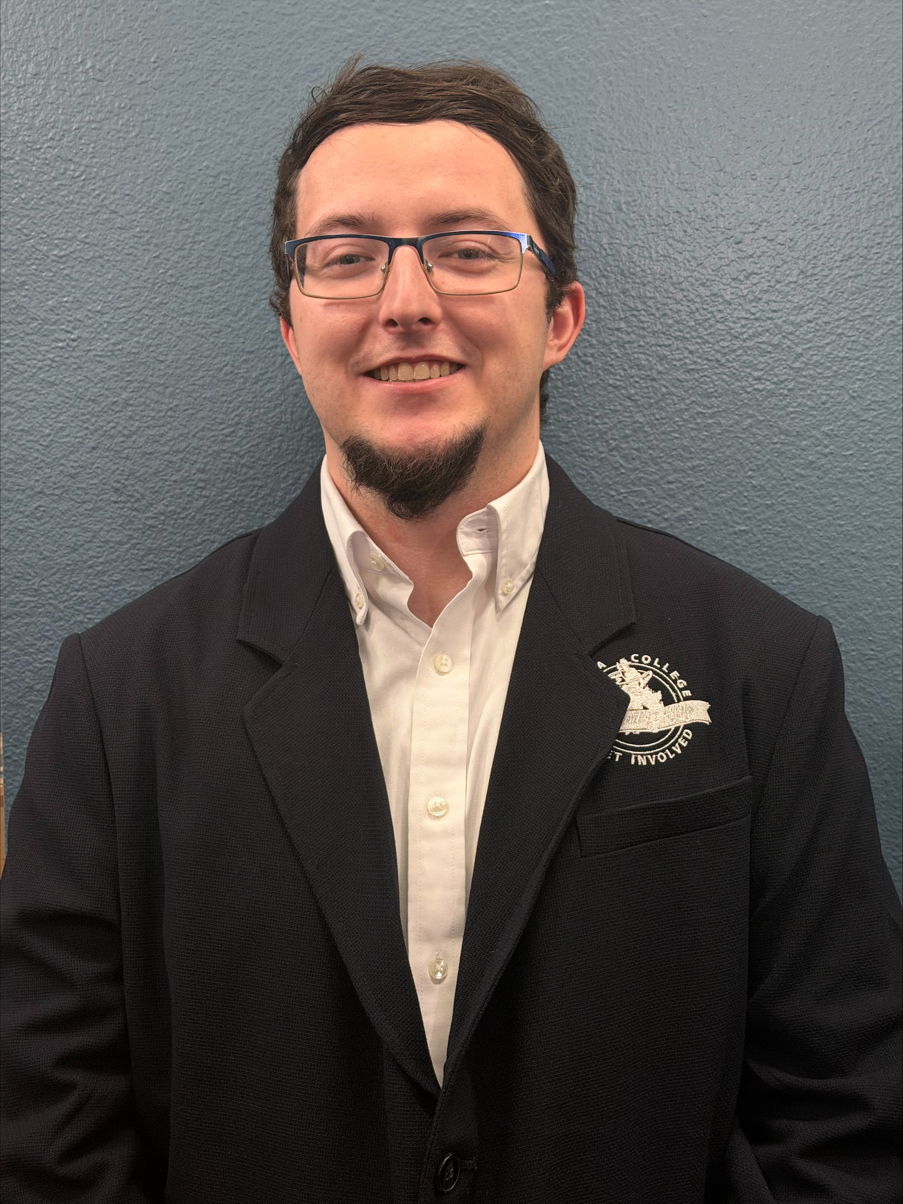 Photo of young man with glasses and goat beard