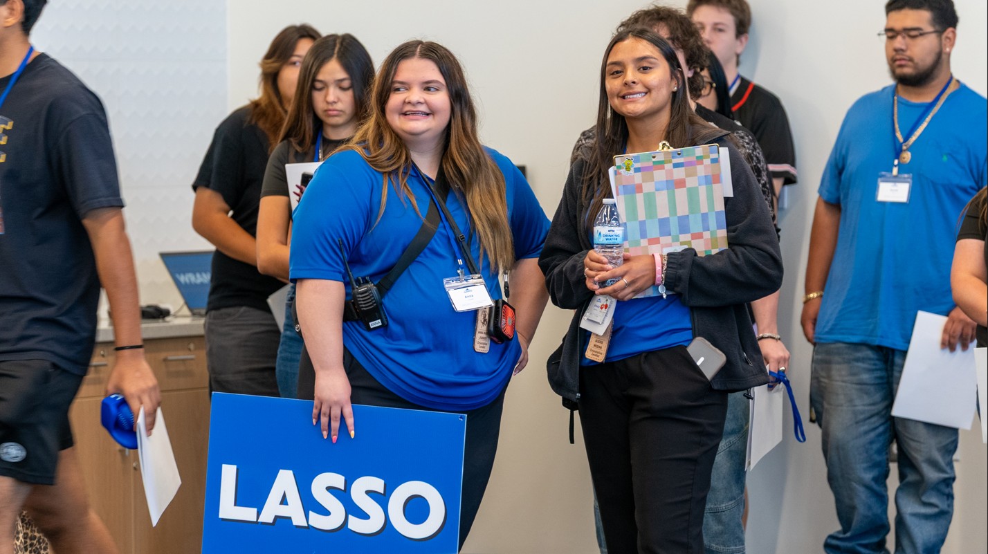 Orientation Leaders with a Lasso Group sign
