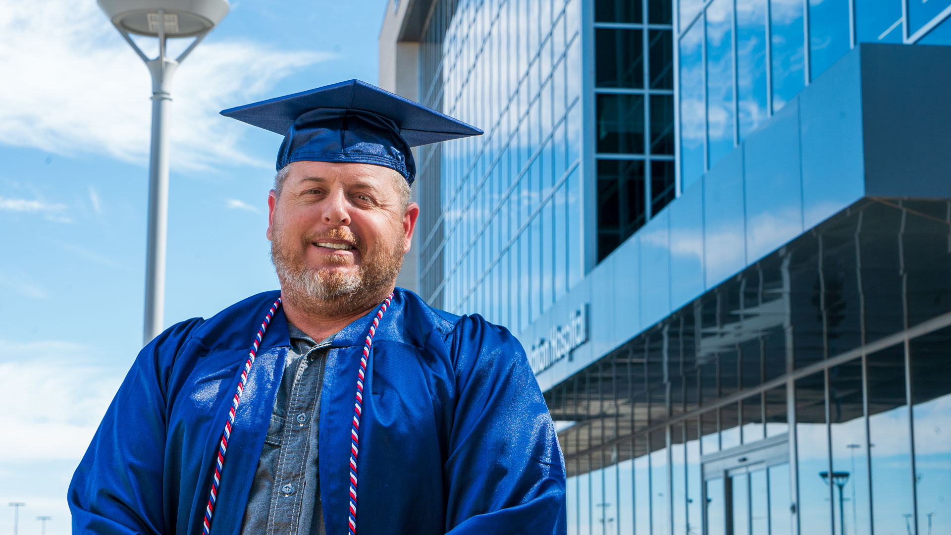 Chris Waters with WHSB behind him