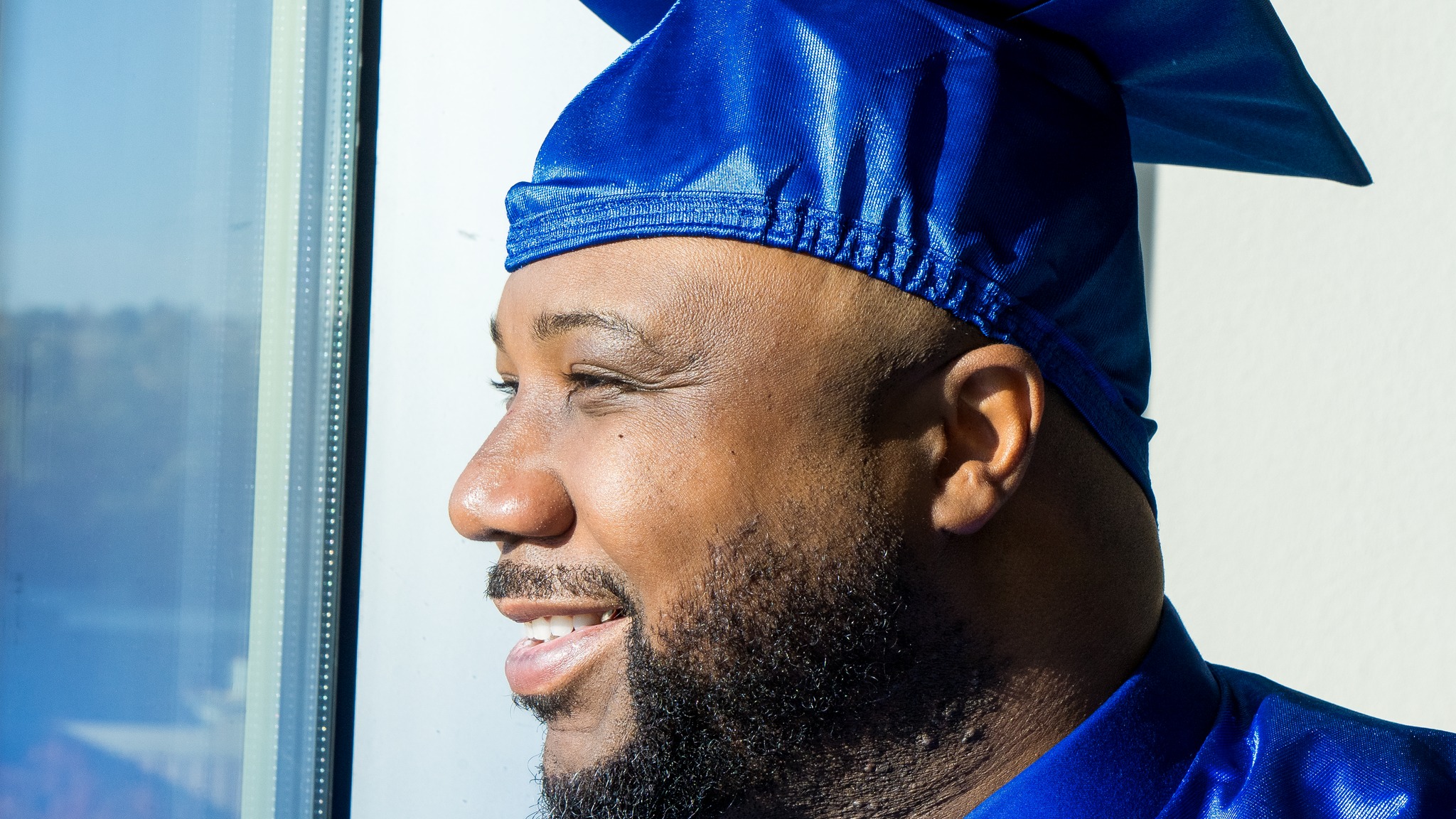 Kory Grant's profile, smiling