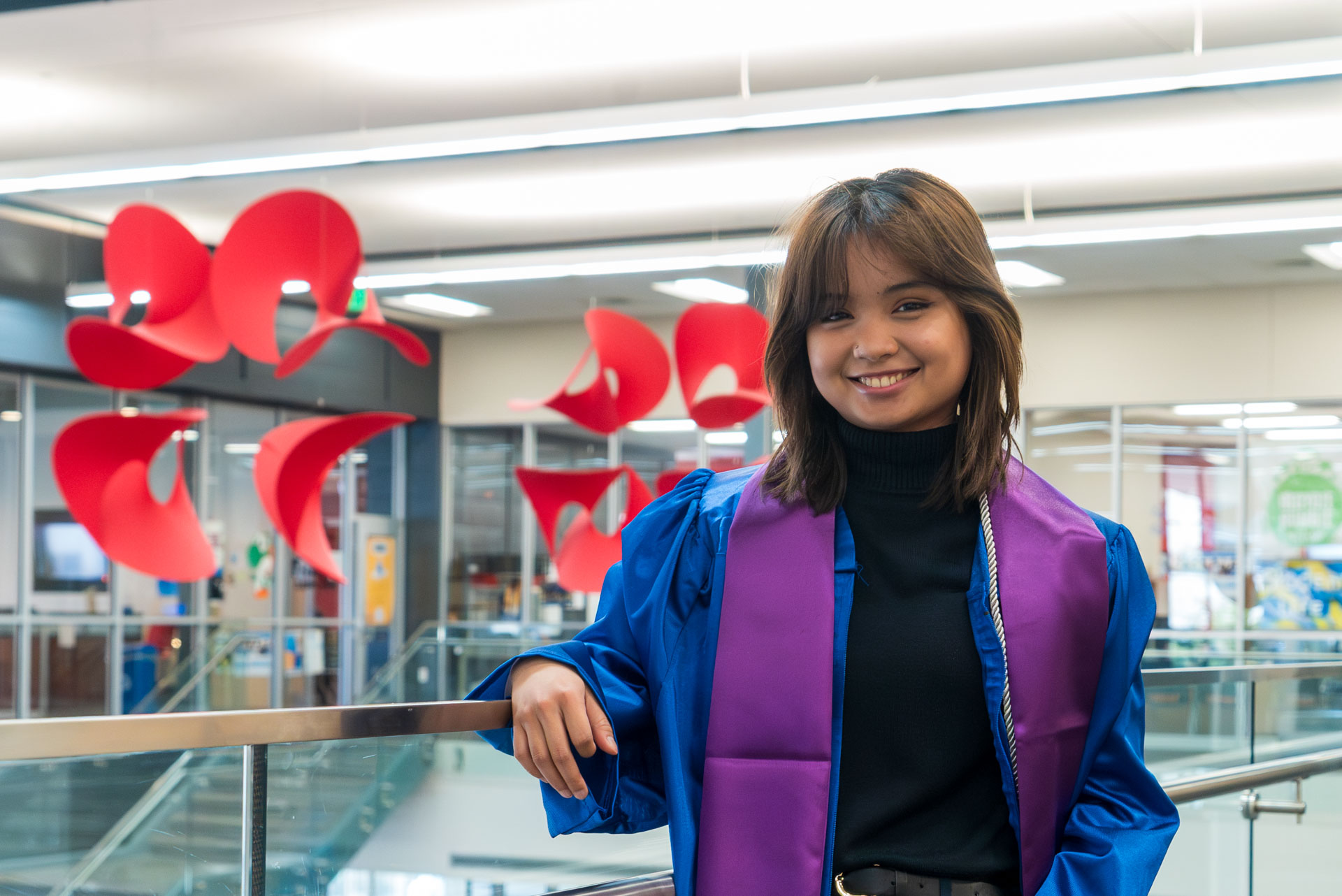 Arabella posing next to balcony railing