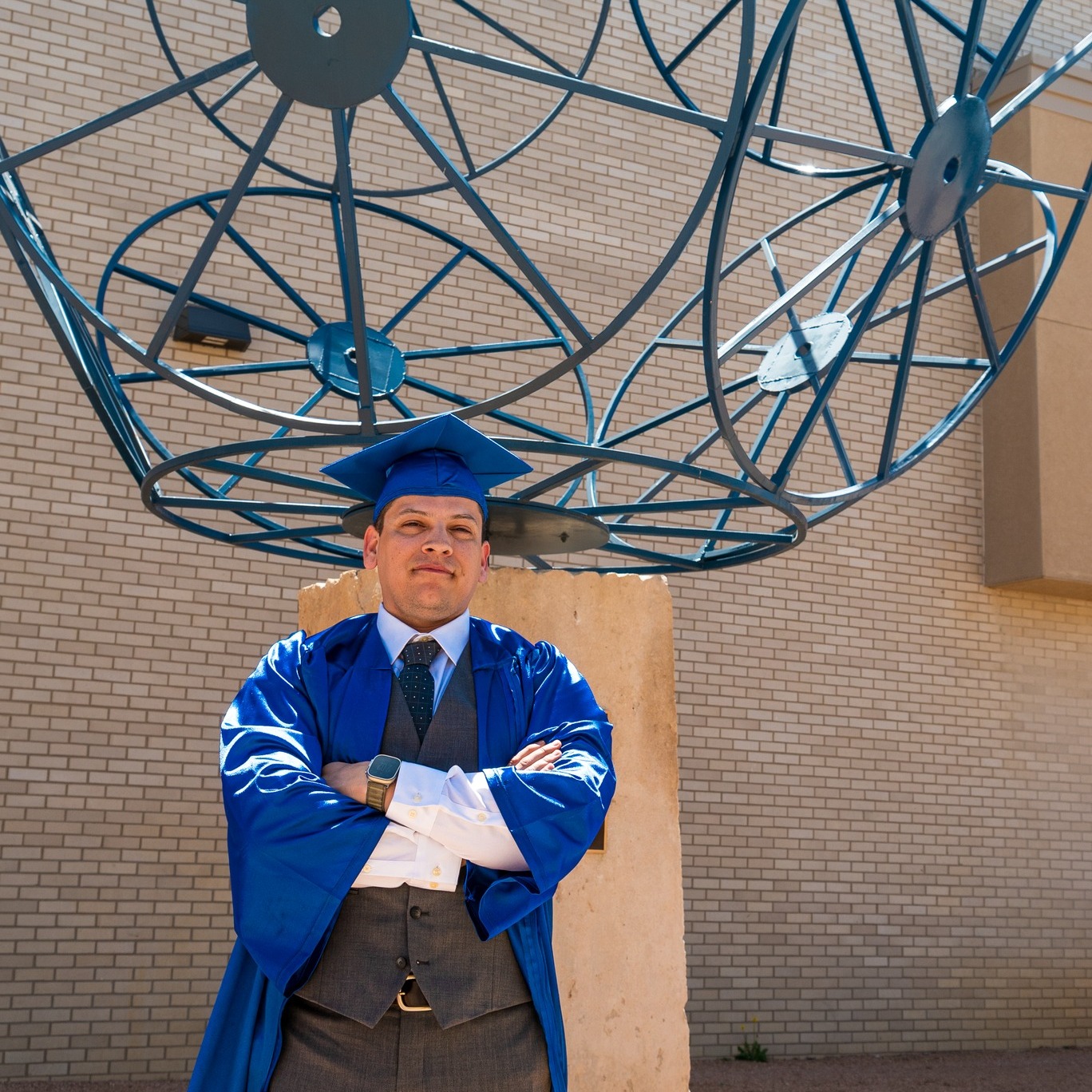 Fernando posing in front of blue statue