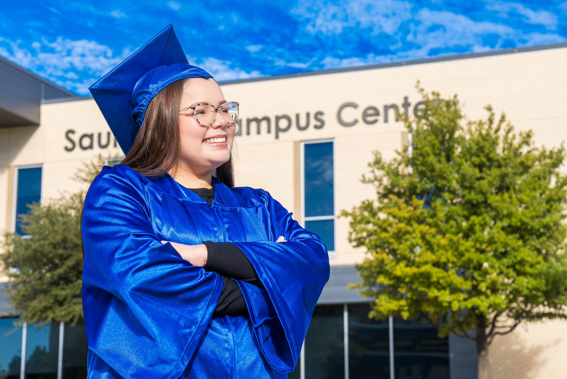 Aide Medina posing in front of building