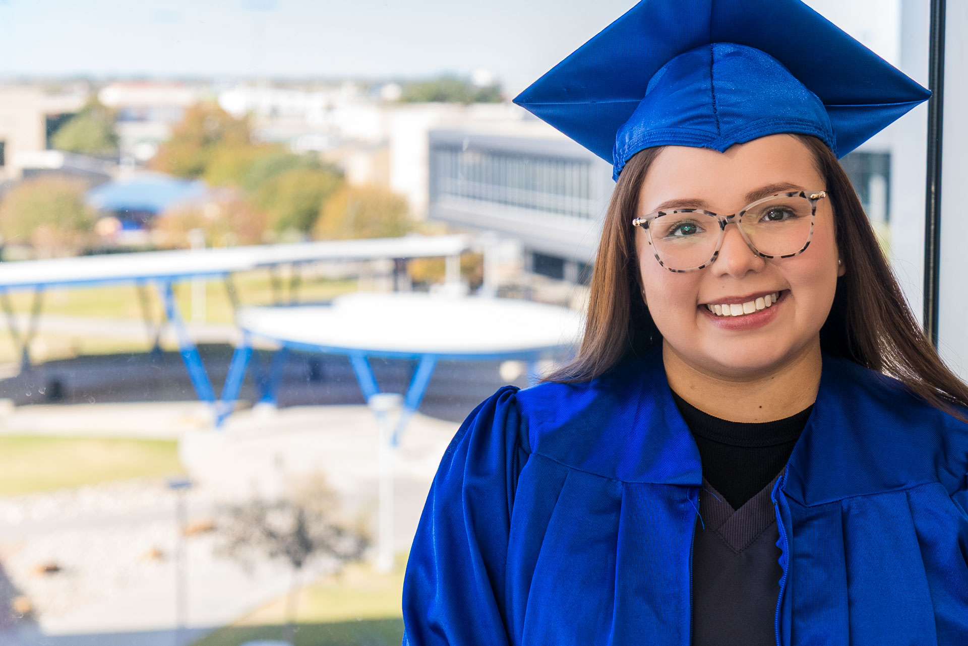 Aide Medina posing by window