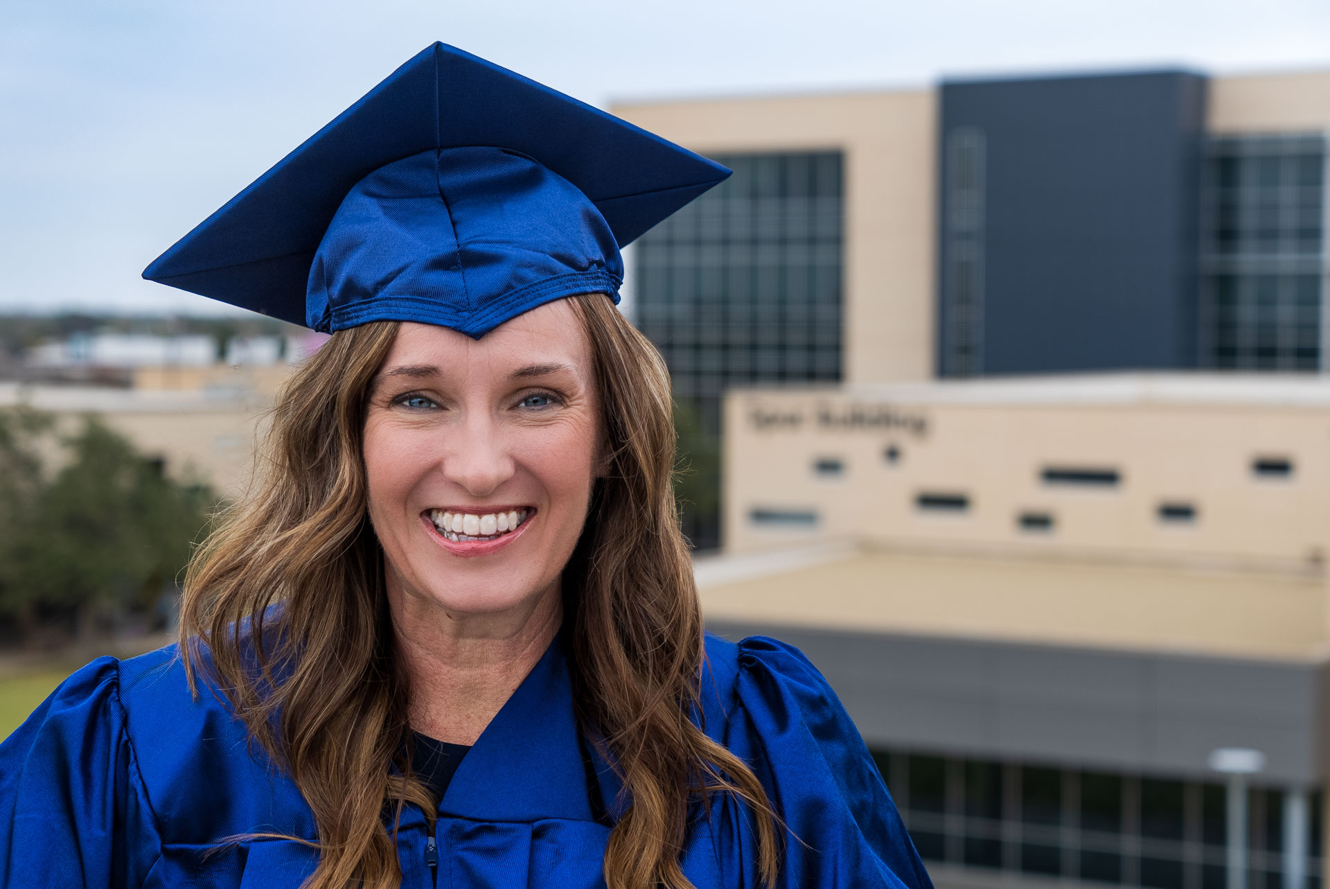 Candy Duke smiling at balcony