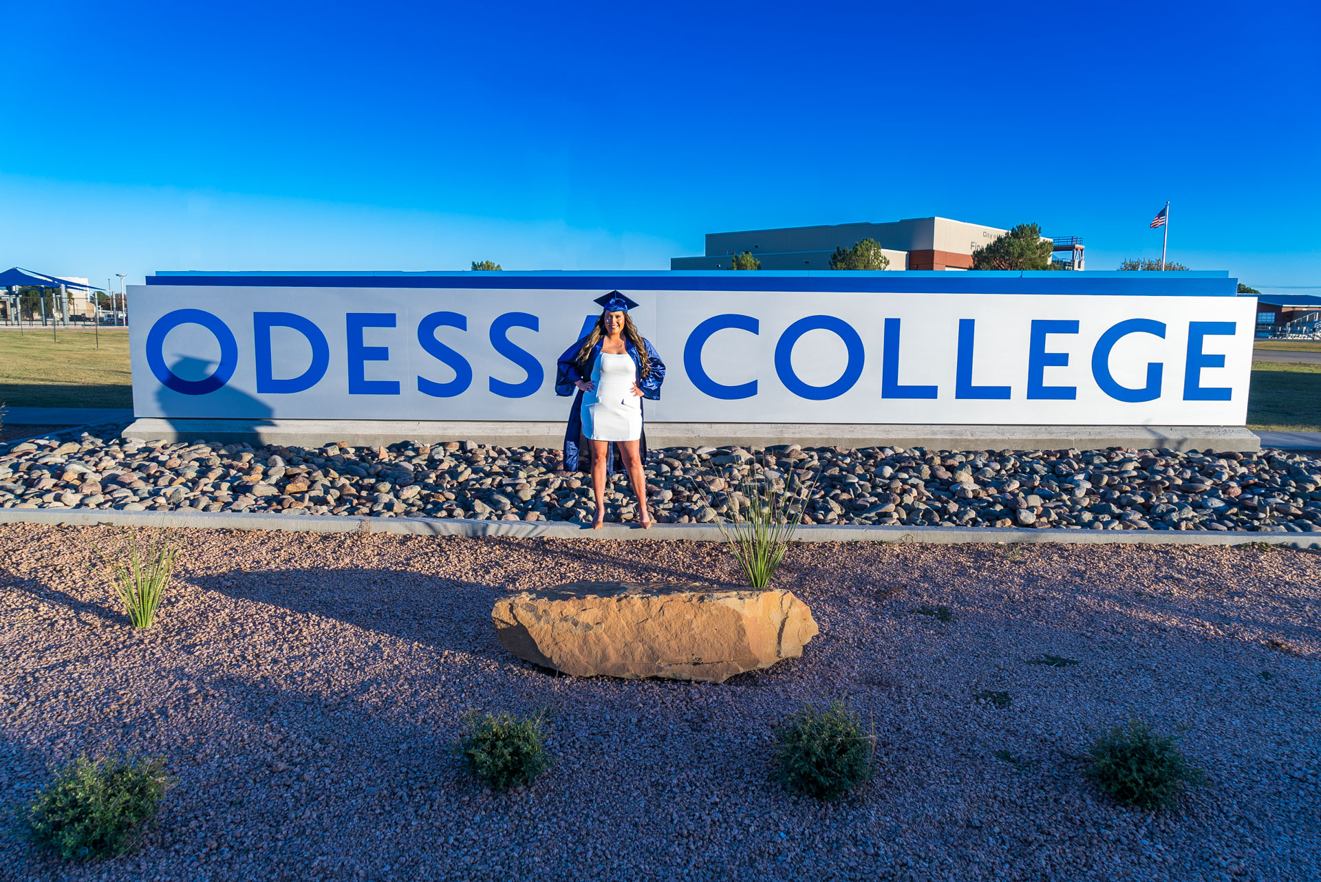 Dalia Mendoza-Salgado in front of OC sign