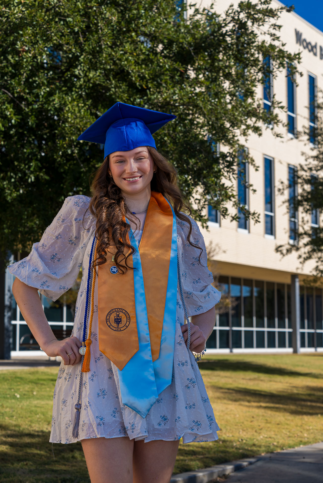 Hadlee Zartner smiling in front of building