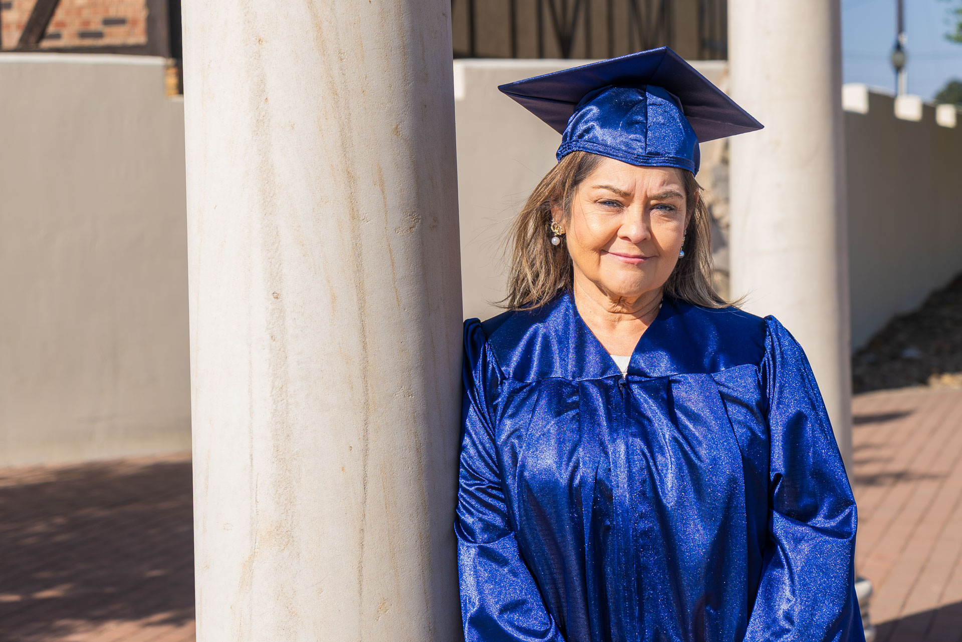 Jeanette Martinez leaning against pillar