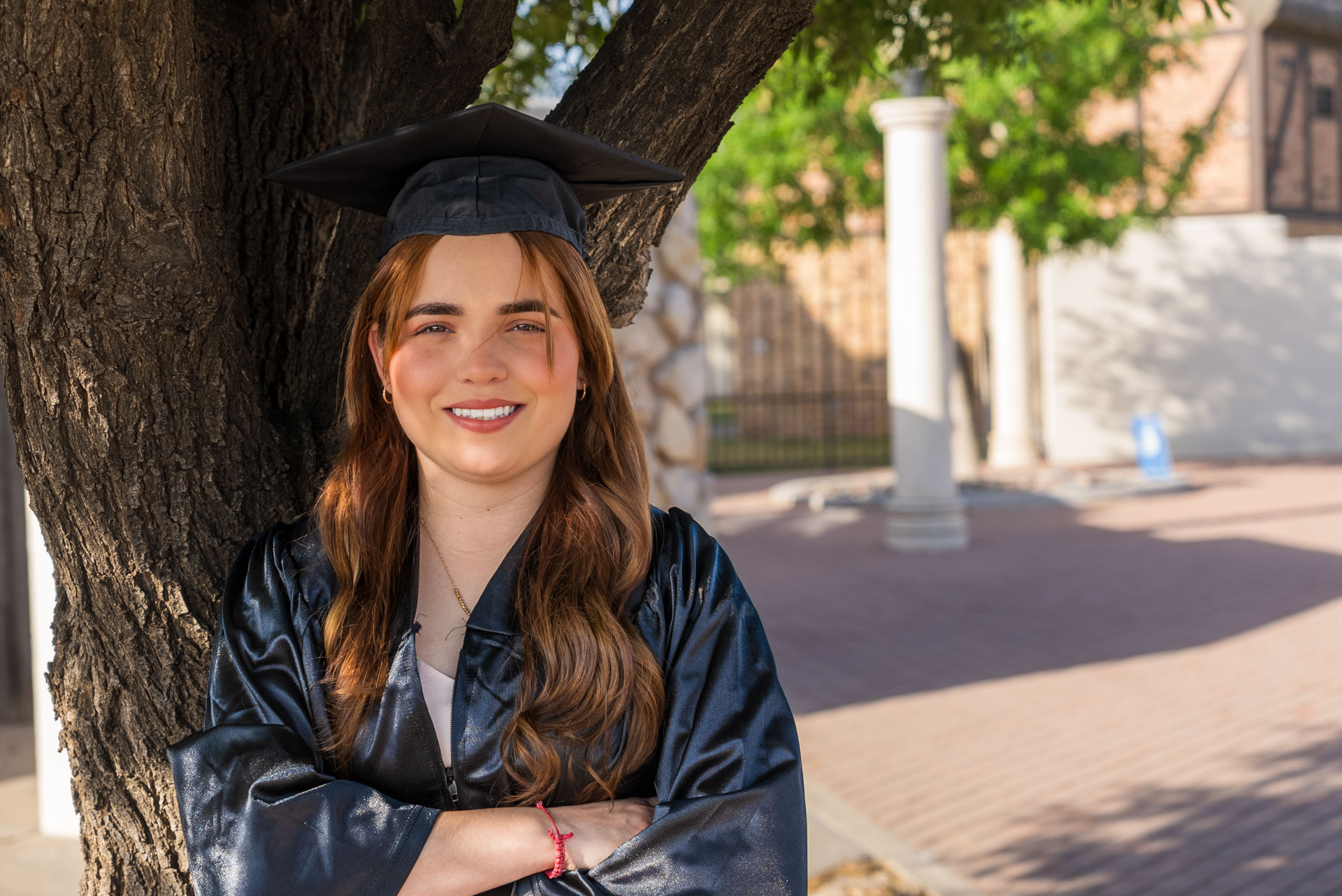 Gissell Fabela leaning against a tree