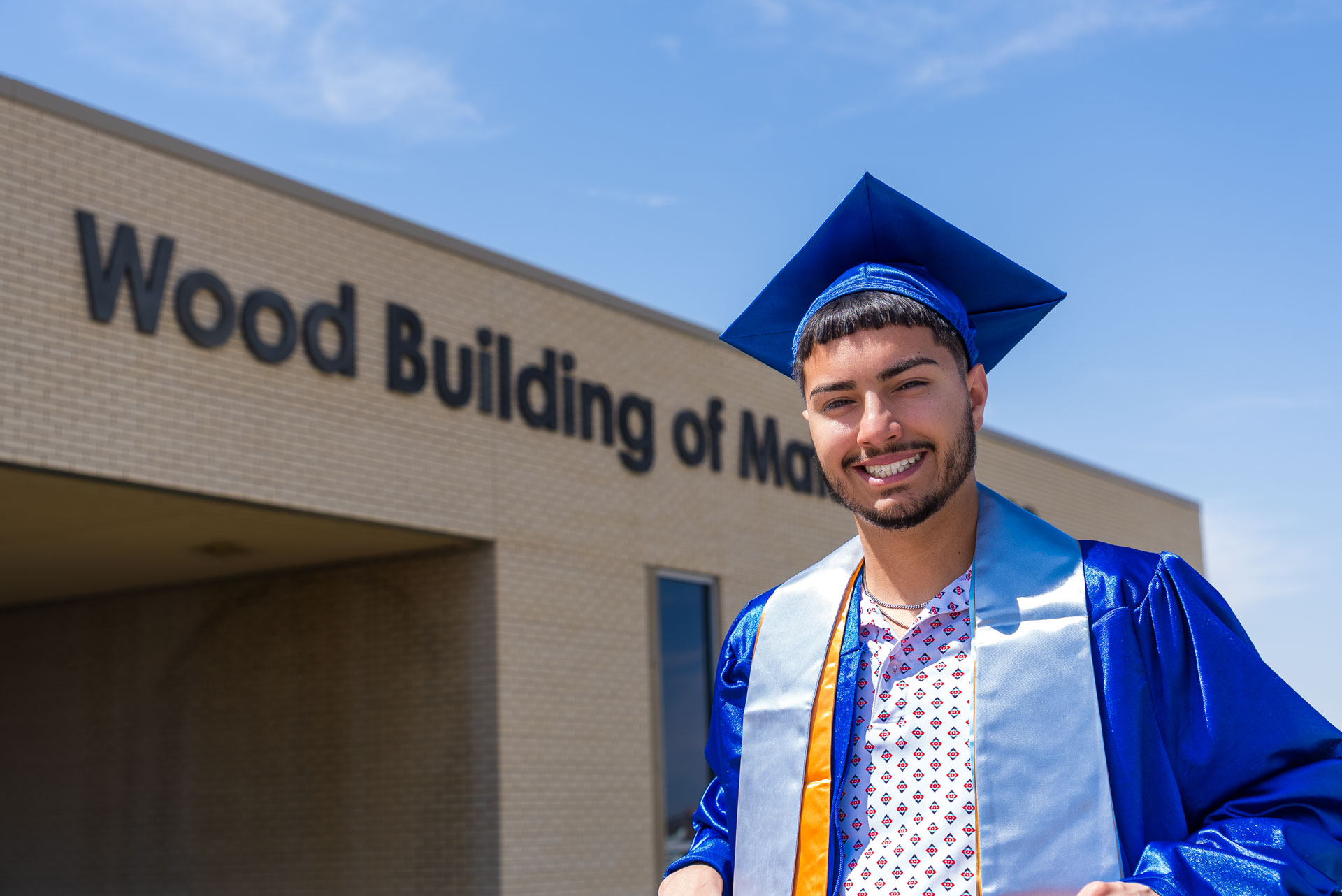 Luis Munoz in front of building