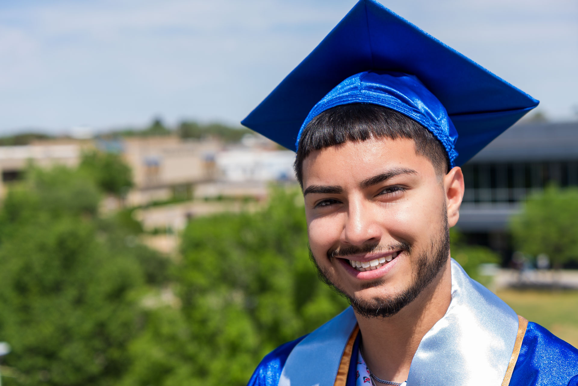 Luis Munoz smiling at balcony