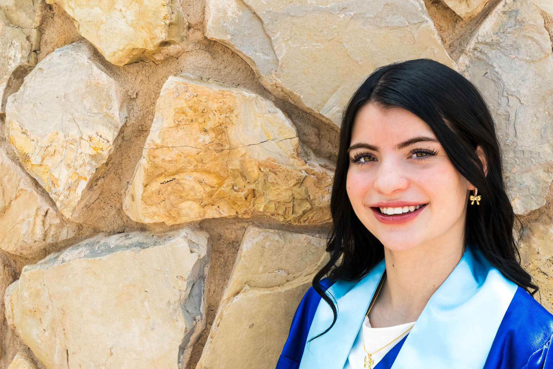Georgia in front of stone wall