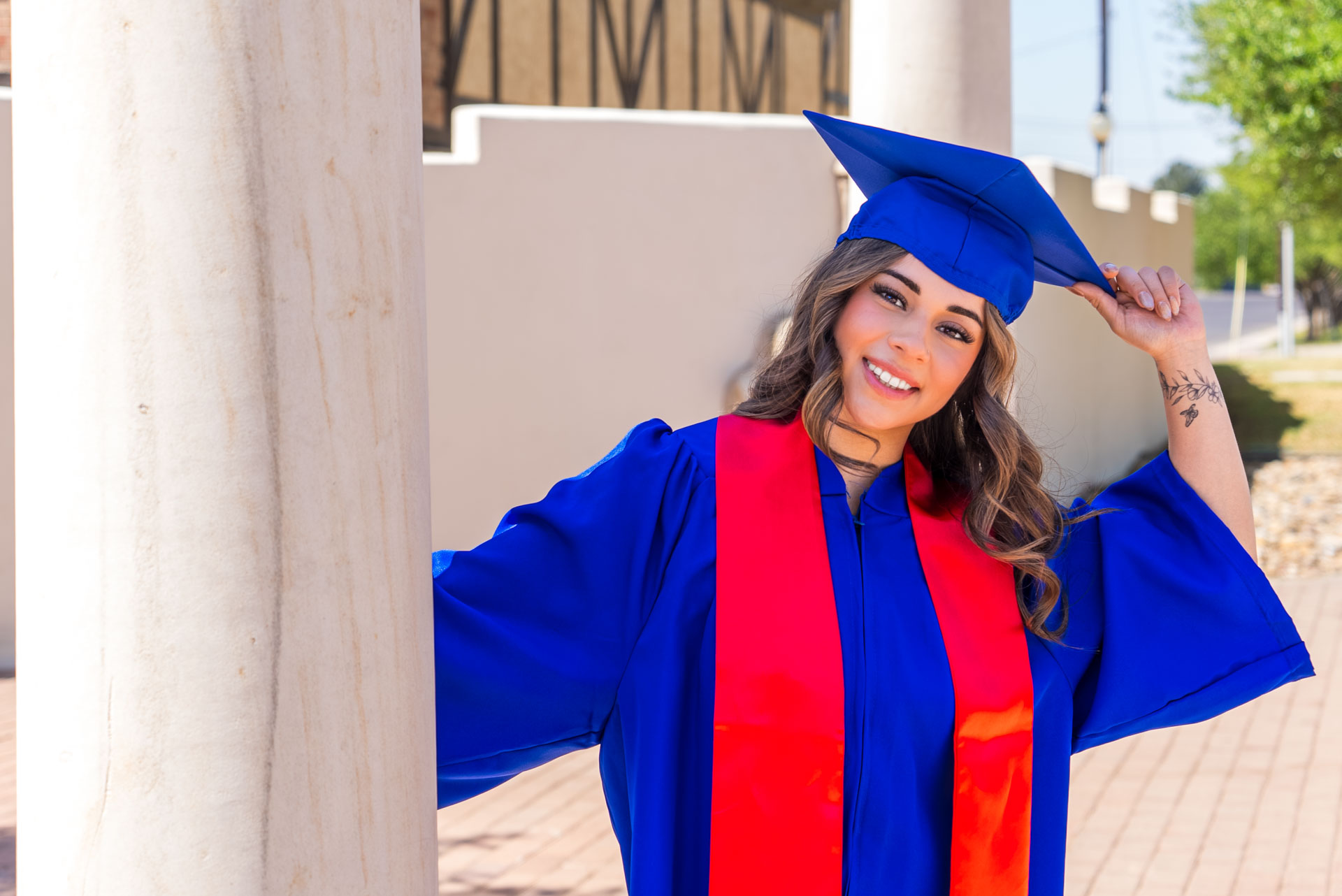 Nevaeh Martinez holding grad cap