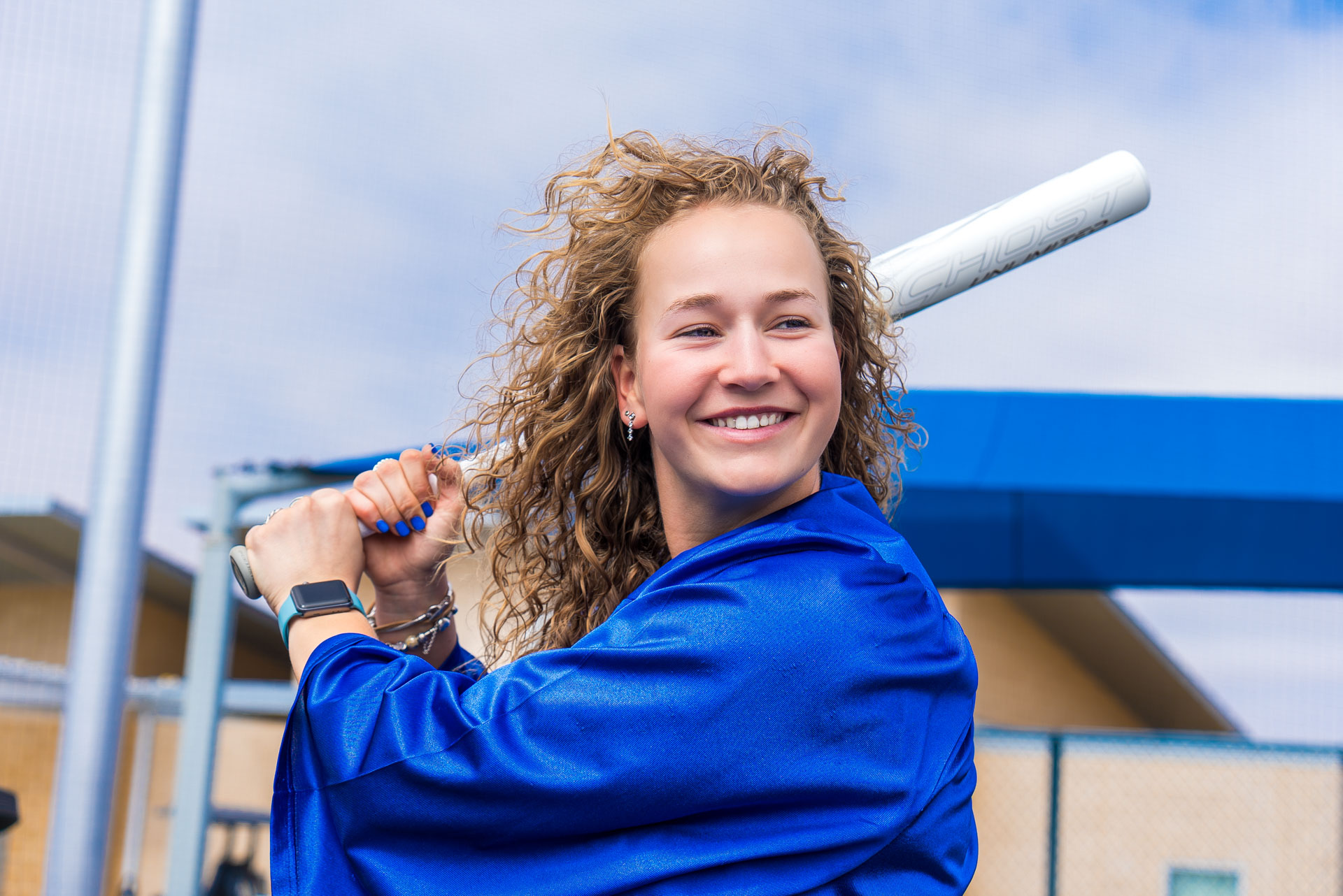 Rens Tellekamp holding bat, ready to swing, and smiling