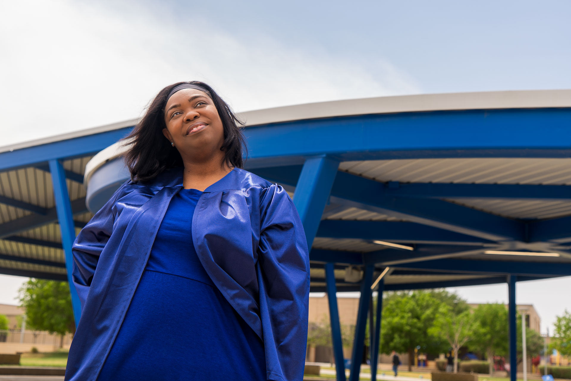 Ruth Watson smiling with amphitheater behind her