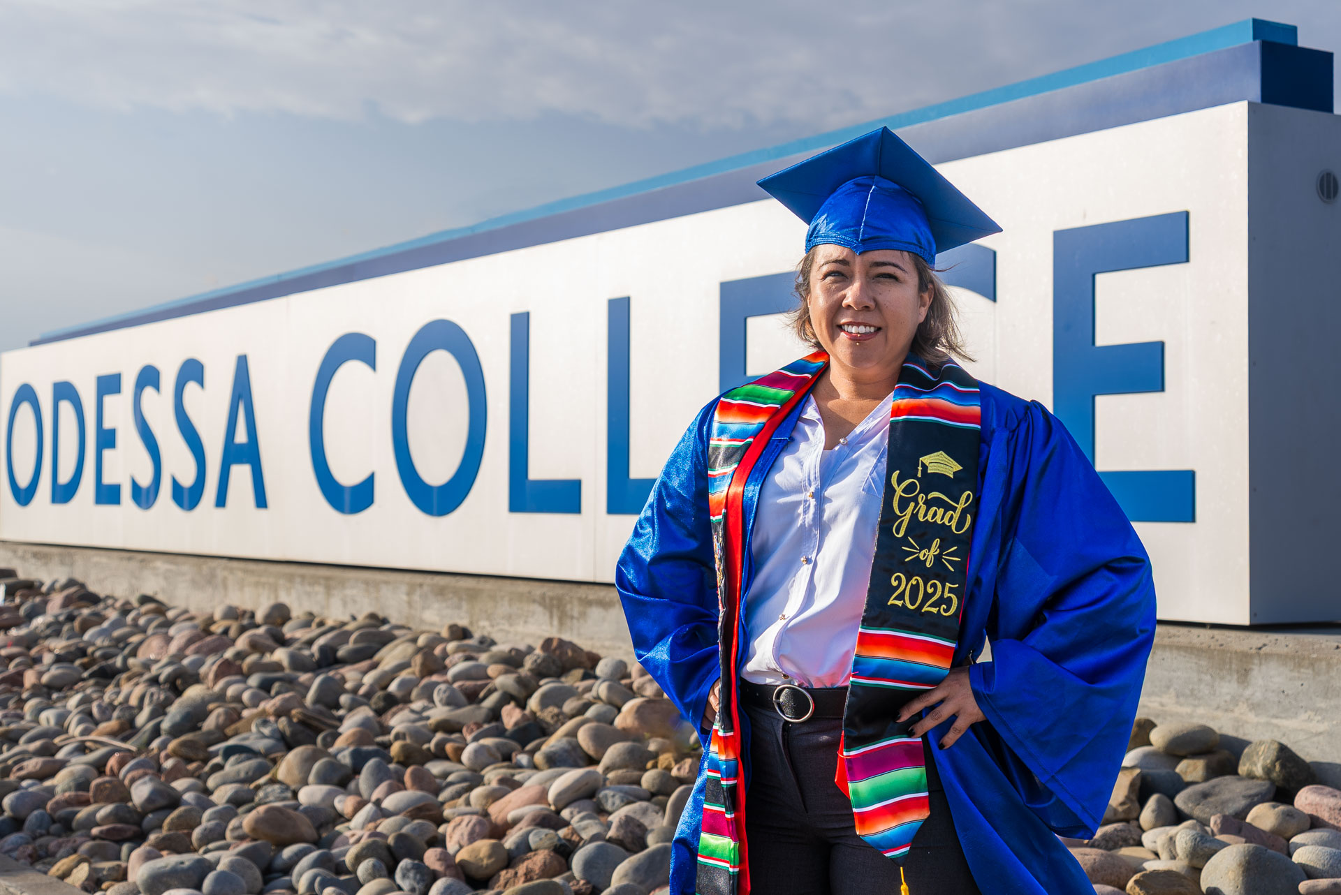 Yaribel Garcia standing in front of OC sign